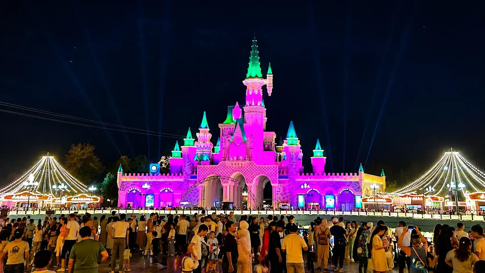 The illuminated castle at Magic City on a summer evening.